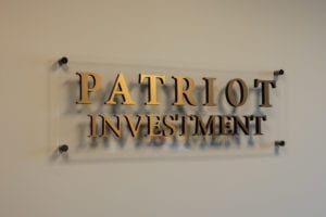 Patriot Investment plaque with golden letters