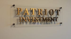 Patriot Investment plaque with golden letters