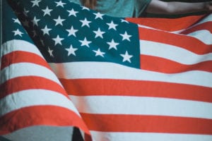 person holding an American flag