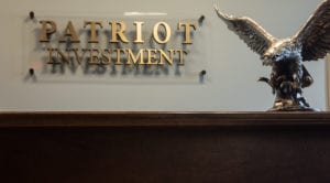 Patriot Investment plaque with statue of eagle