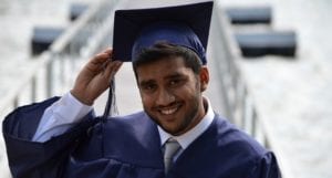 young man in graduation cap and gown