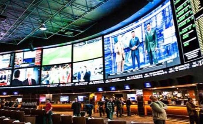 Large display of television screens in a sports betting center